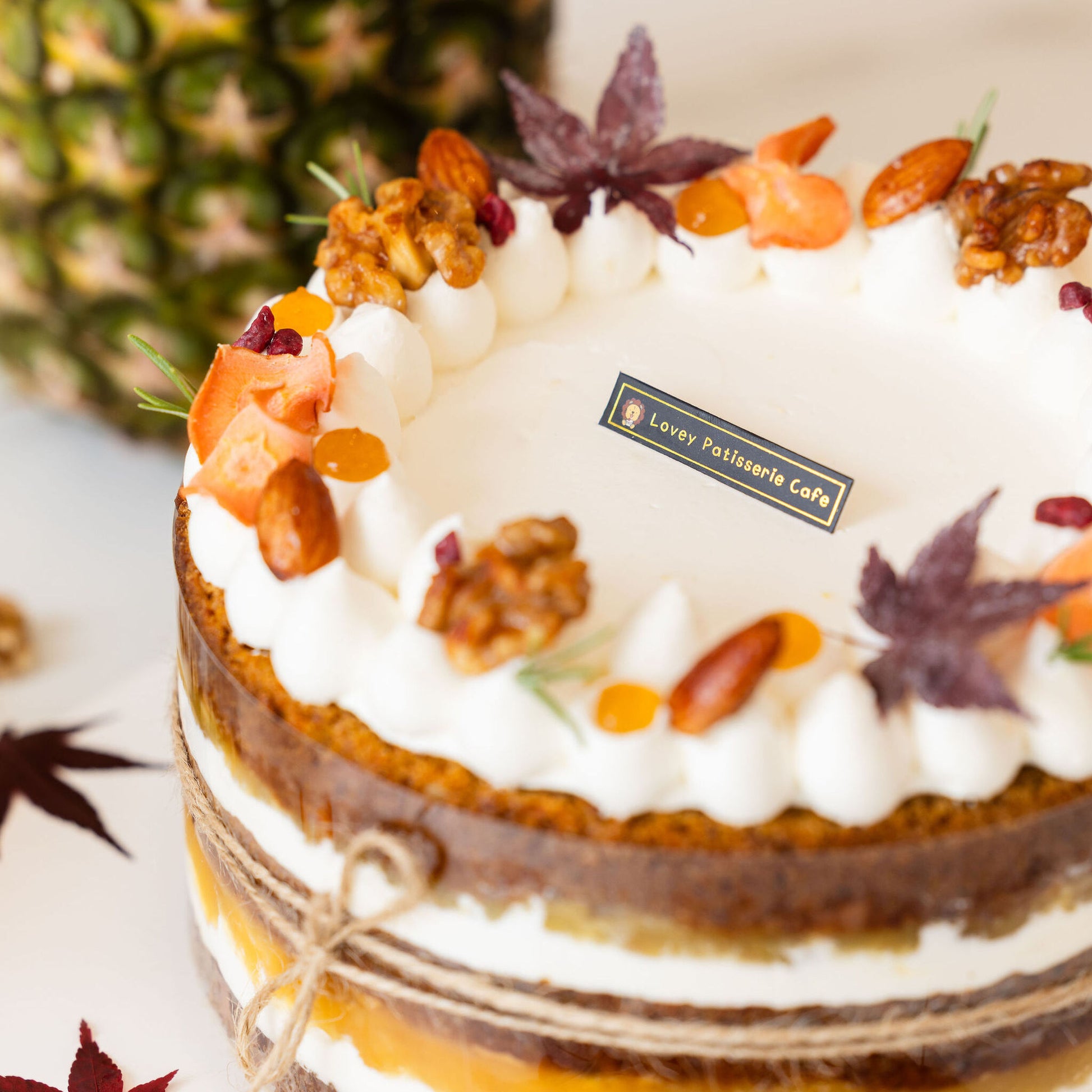 Close-up of plant-based frosting and carrot garnish on vegan carrot shortcake.