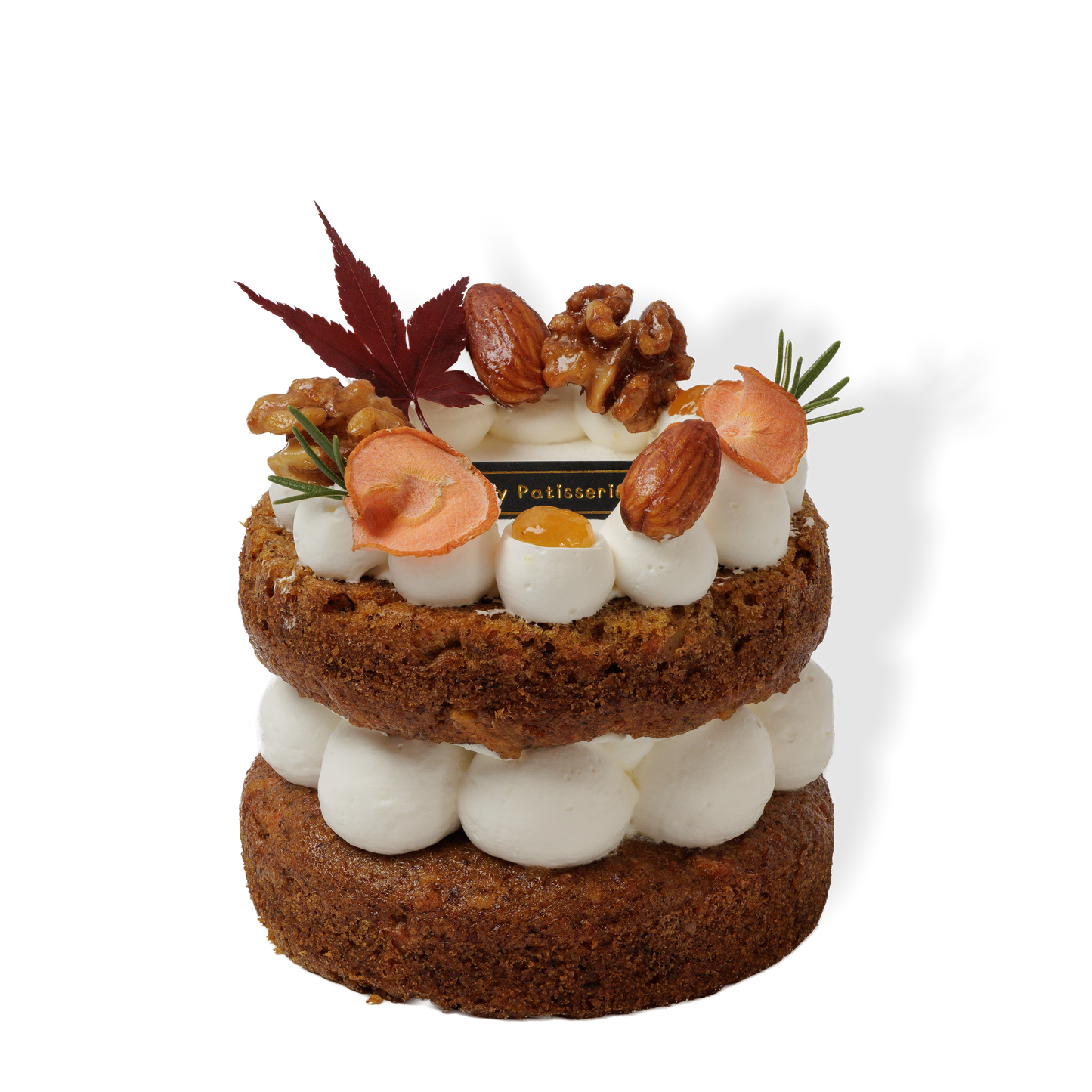 Slice view of vegan carrot shortcake revealing airy chiffon sponge and smooth frosting layers.