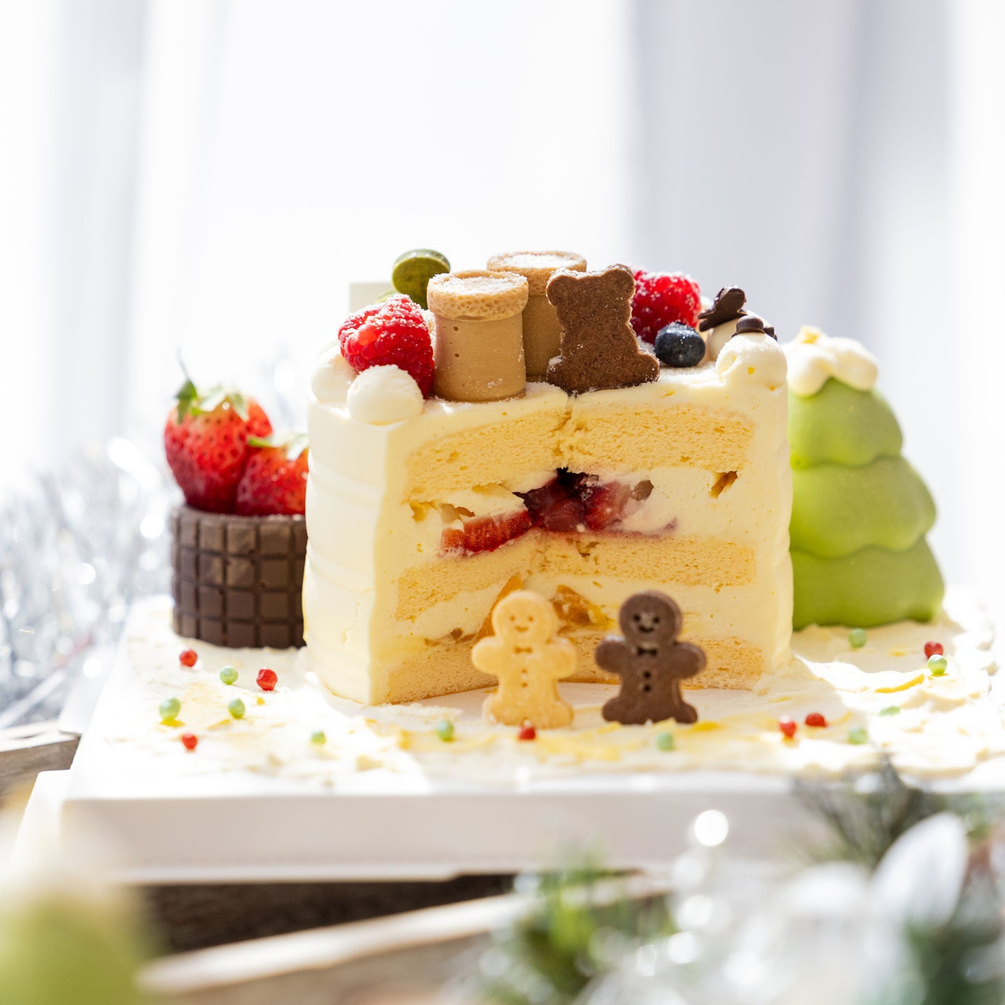 Close texture shot of Christmas Chocolate Fantasia Strawberry Mango Shortcake showing cream and sponge quality