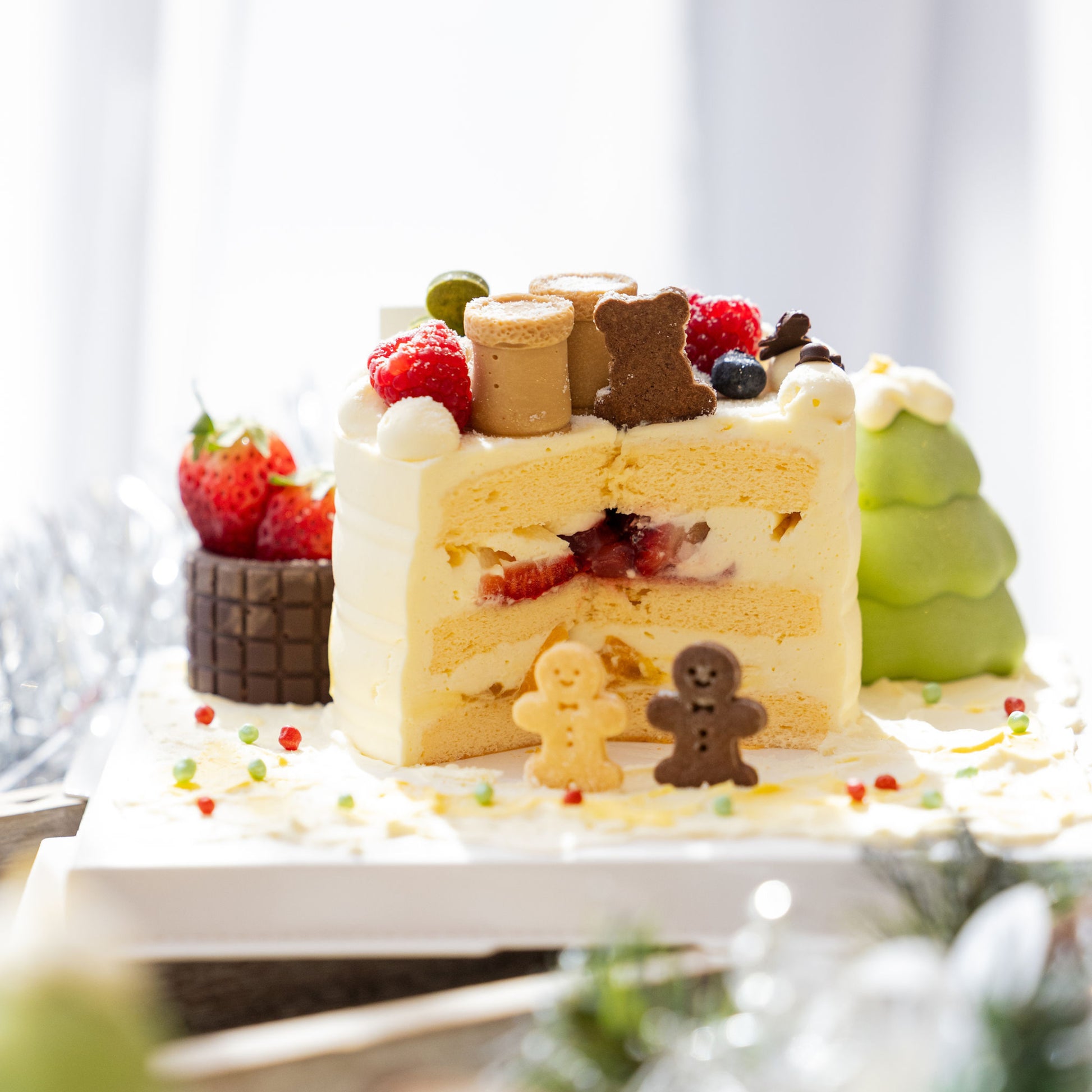 Close texture shot of Christmas Chocolate Fantasia Strawberry Mango Shortcake showing cream and sponge quality