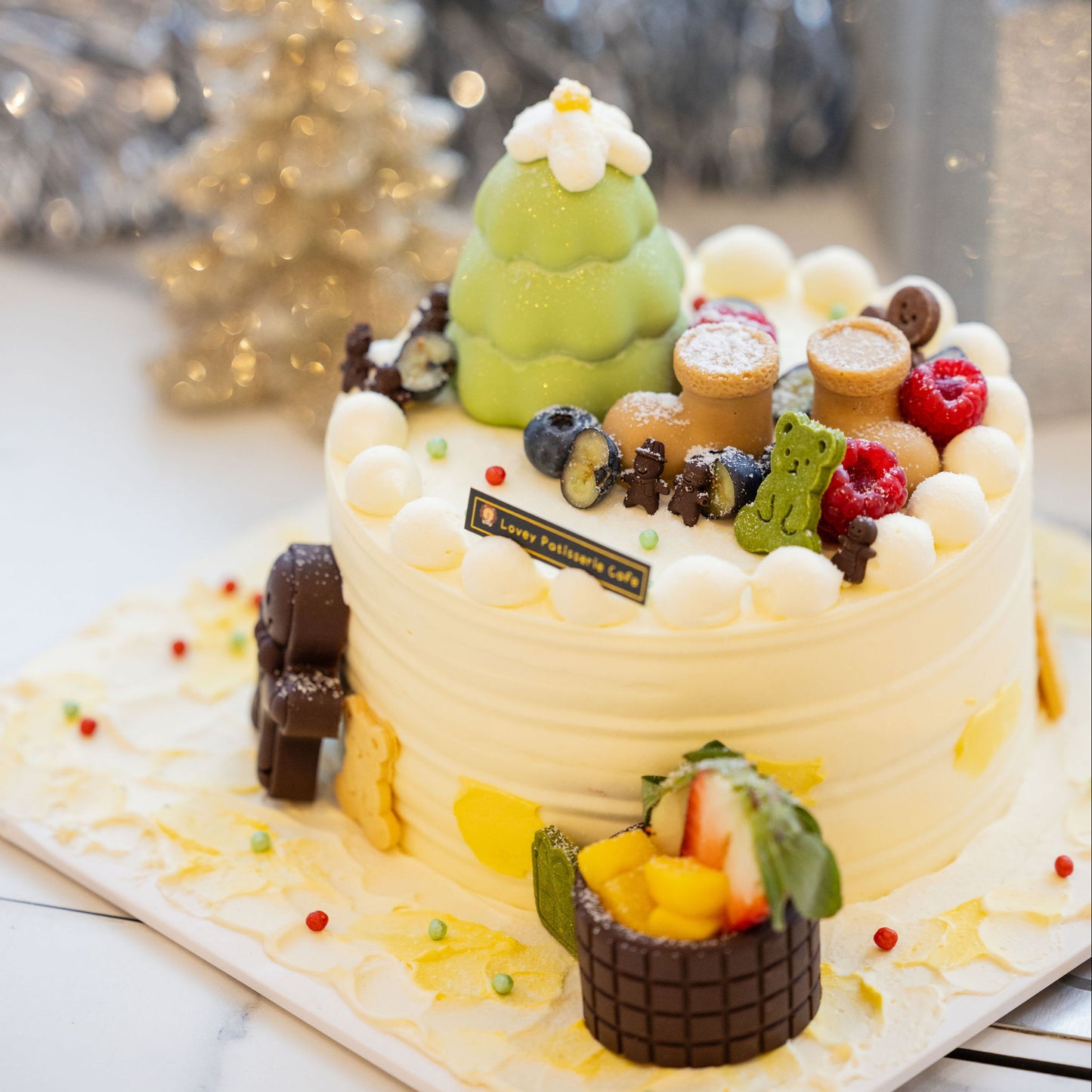 Top view of Christmas Chocolate Fantasia Strawberry Mango Shortcake with festive decorations