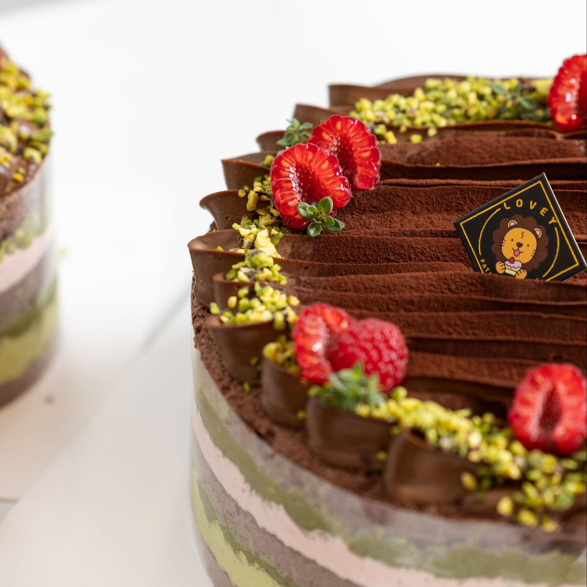 Close-up of pistachio cream, chocolate elements and crunchy pistachio kataifi in Dubai Chocolate Pistachio Shortcake.