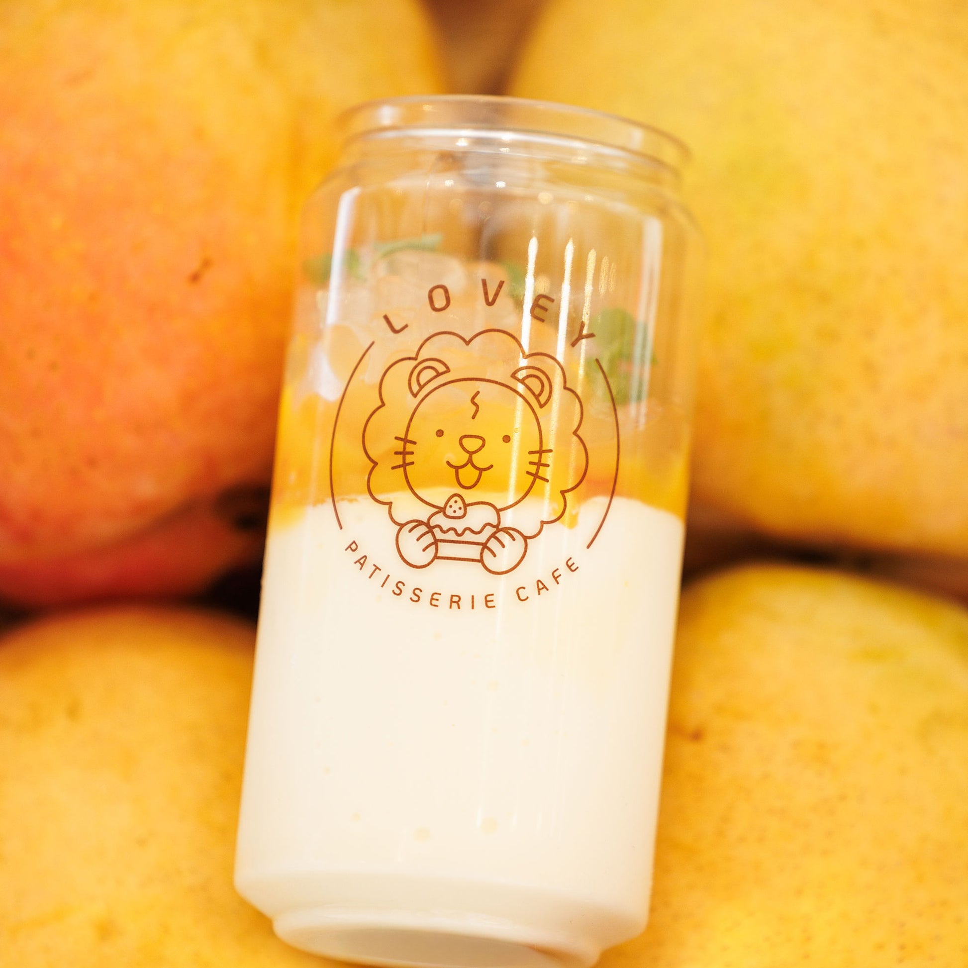 Close-up of fresh mango panna cotta showing silky panna cotta base and vibrant mango layer.