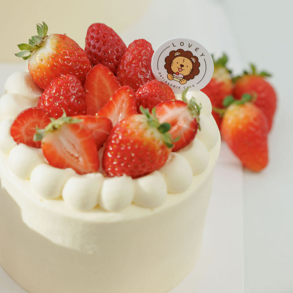 Close-up of Fresh Strawberry Shortcake ingredients including fresh strawberries and cream