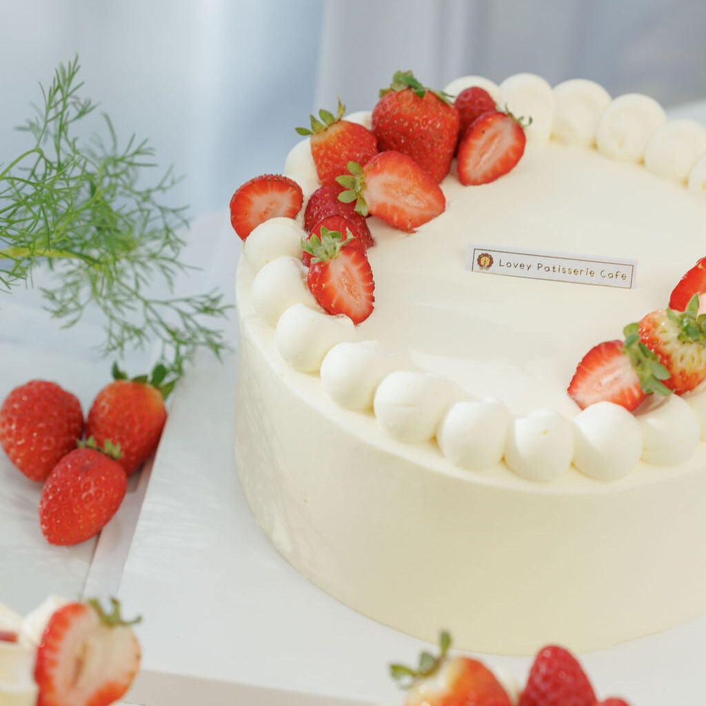 Fresh Strawberry Shortcake styled with dessert setting, showcasing Lovey Patisserie Cafe presentation