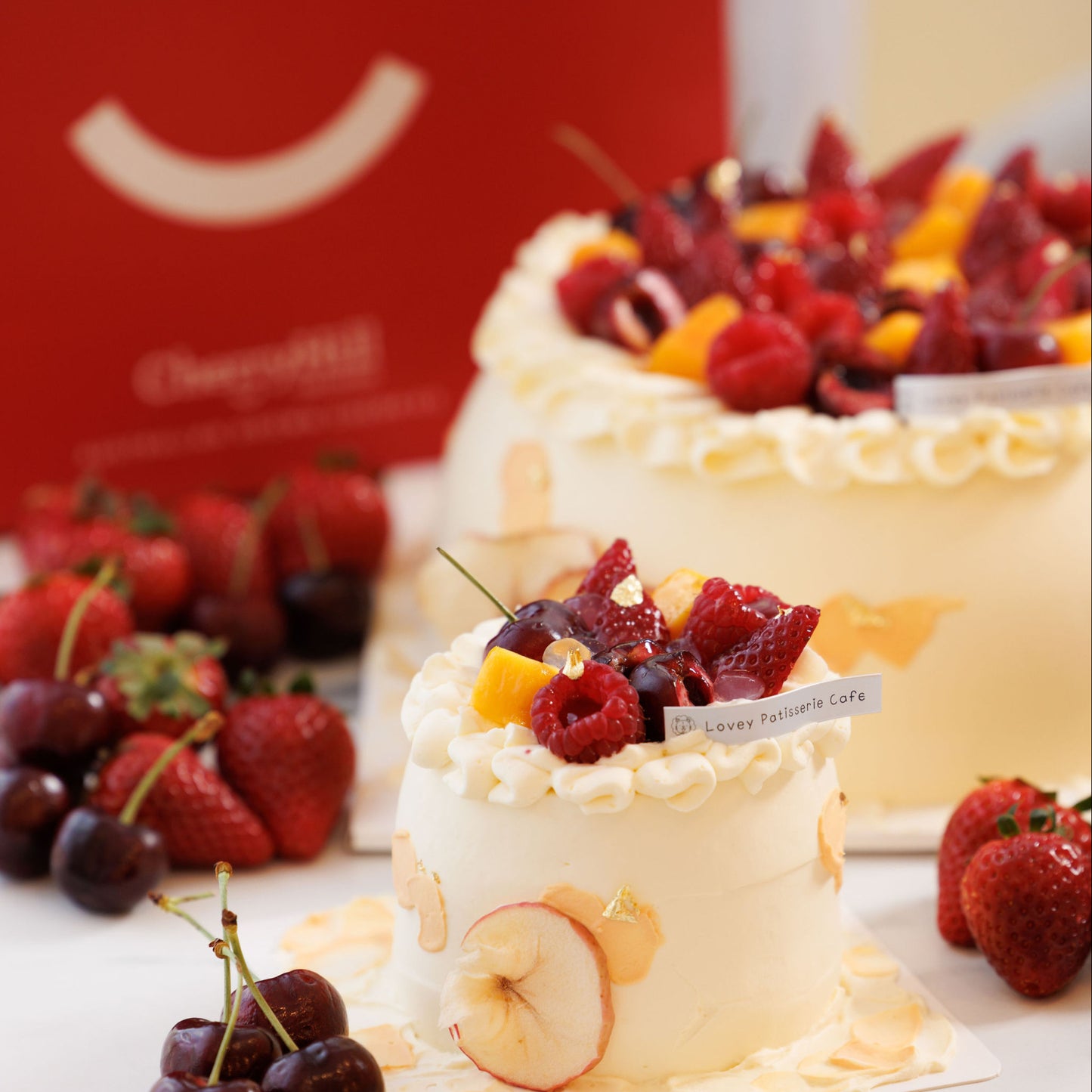 Close-up of hawthorn and apple fruit decoration on a light chiffon shortcake with festive red tones.