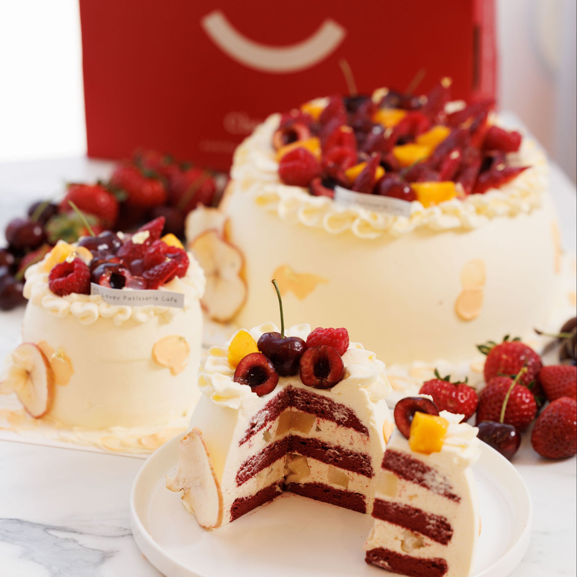 Slice view of hawthorn elderflower apple shortcake revealing airy chiffon sponge and gently tangy cream layers.