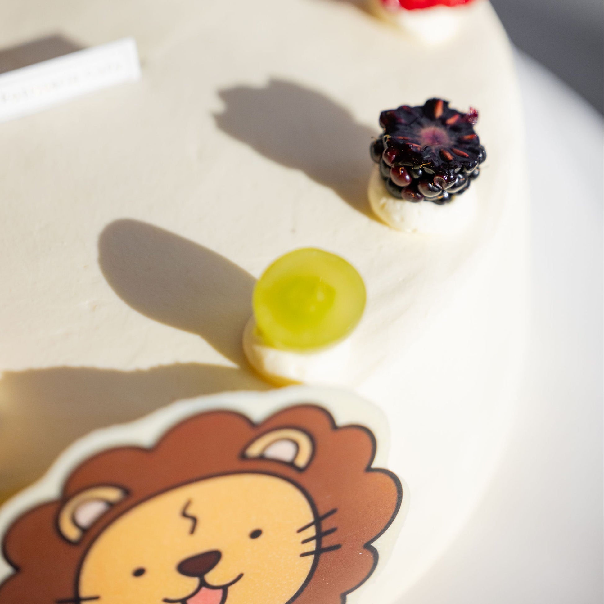 Top detail of Lovey Classic Chiffon Cream Cake featuring delicate whipped cream and finishing touches.