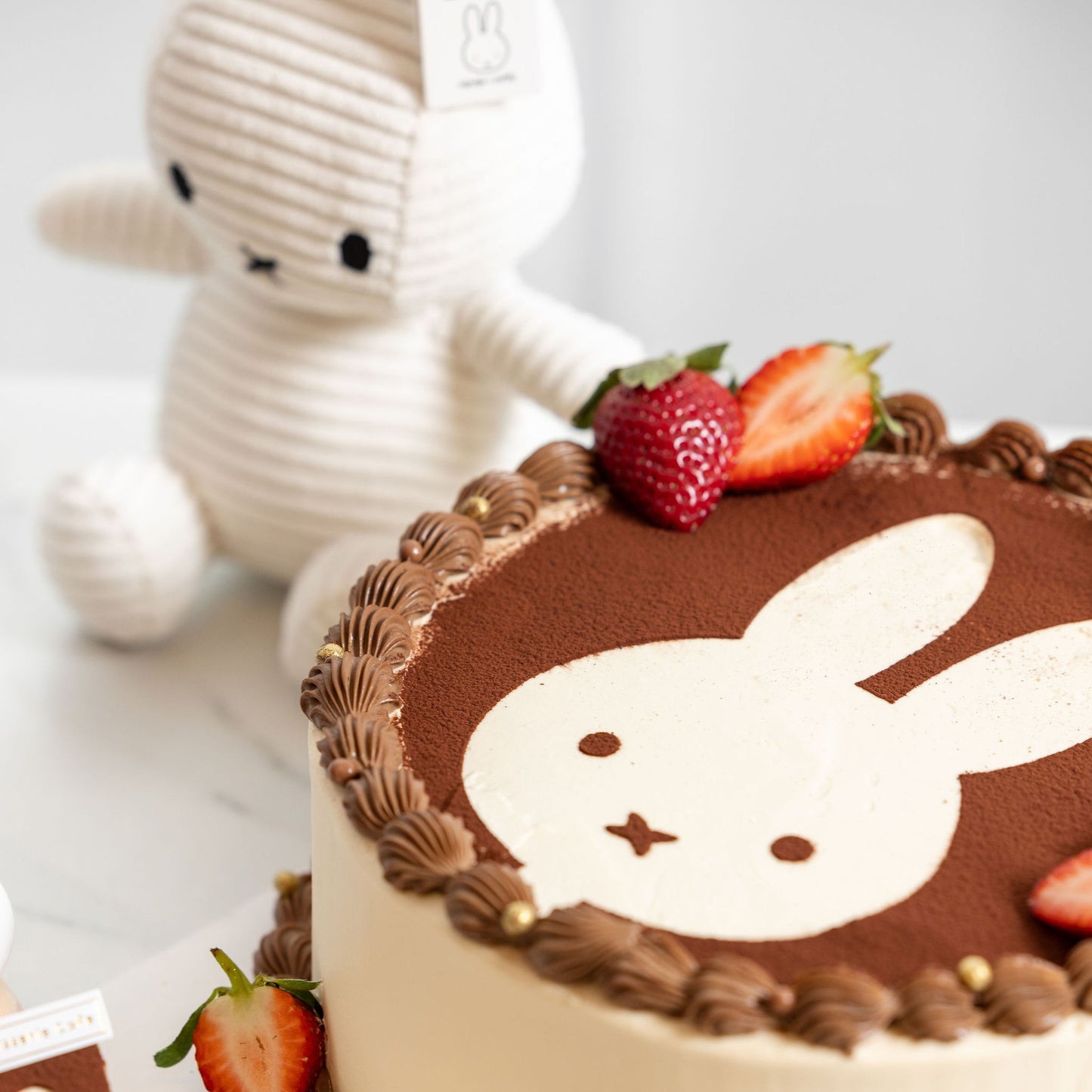 Slice view of Miffy Tiramisu Shortcake showing soft sponge and tiramisu cream filling.