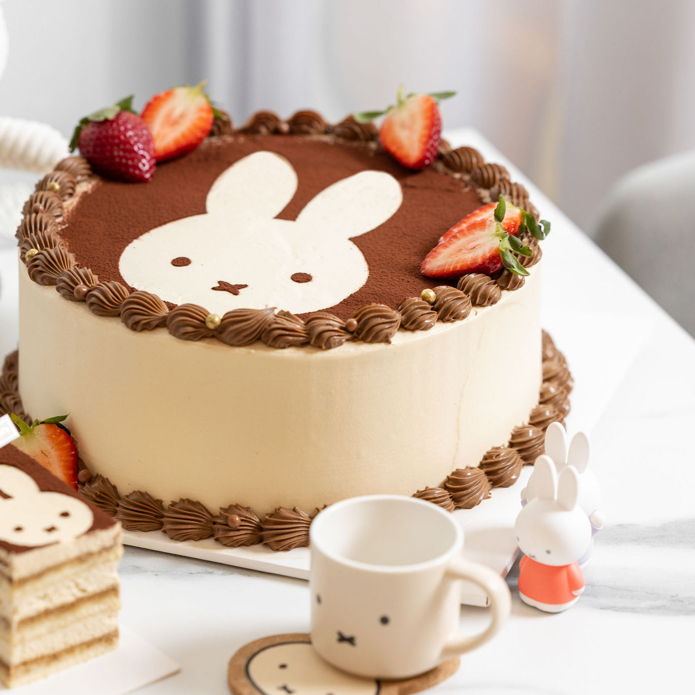 Top detail of Miffy Tiramisu Shortcake showing cocoa-dusted cream and elegant decoration.
