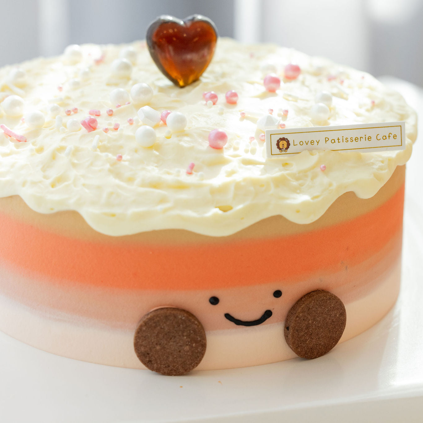 Slice view of Thai Milk Tea Amuseable Shortcake showing multiple chiffon layers and milk tea cream filling.