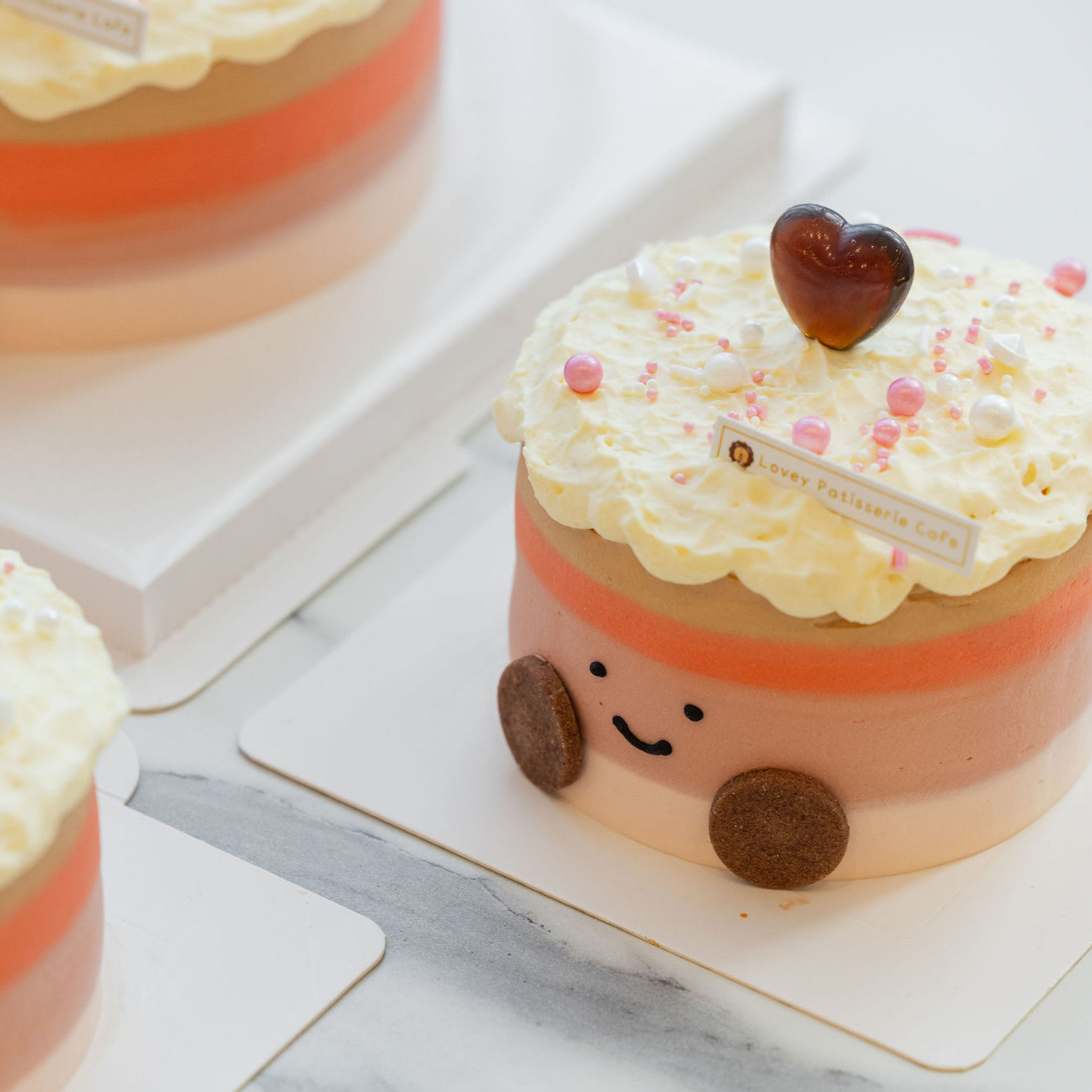 Top view of Thai Milk Tea Amuseable Shortcake showcasing decorative swirls and tea-infused cream layers.